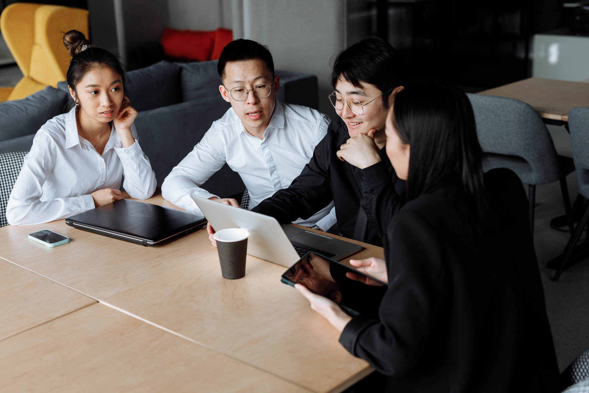 A Group of People Having a Meeting in the Office